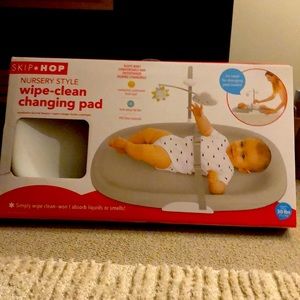 Skip hop nursery style wipe clean changing pad.
